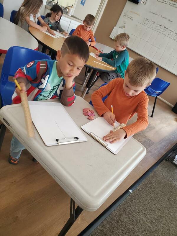 Children measuring with rulers