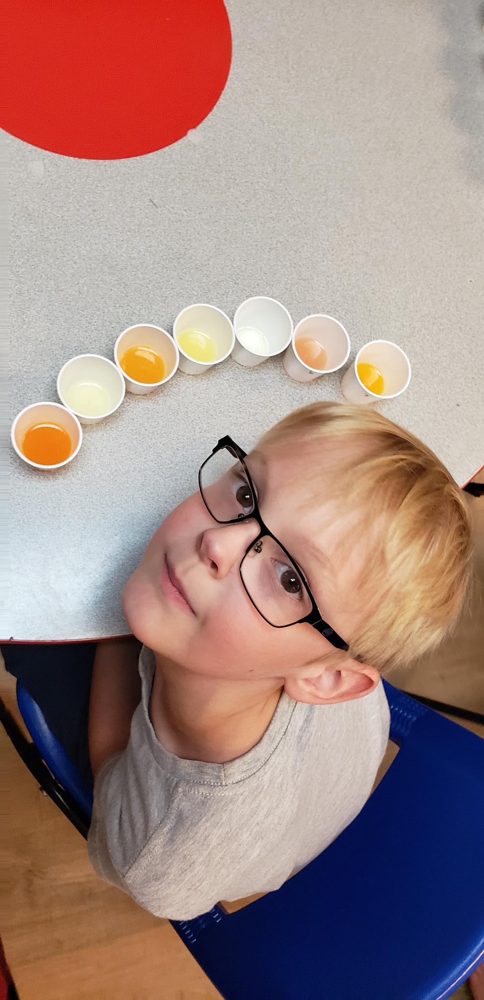 Boy taste testing juices