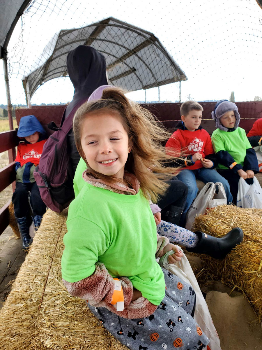 Girl smiling on a hayride